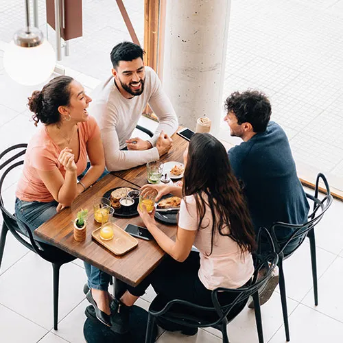 a group of college students eating together